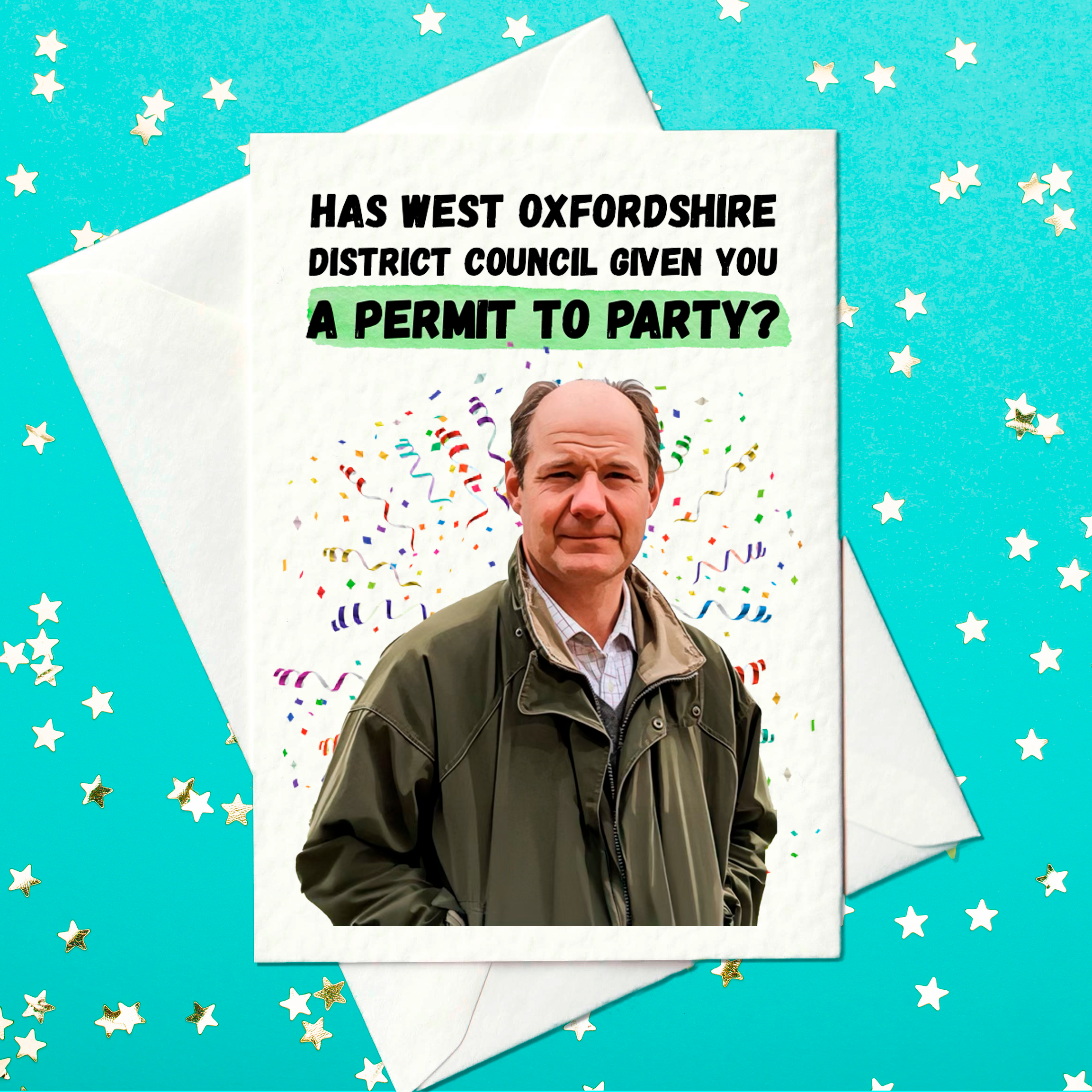 Funny birthday card featuring a serious-looking man in a green jacket with the caption "Has West Oxfordshire District Council given you a permit to party?" The phrase "permit to party" is highlighted in green. The man is surrounded by colourful confetti. Card is A6 in size, shown with a white envelope on a turquoise star-patterned background.